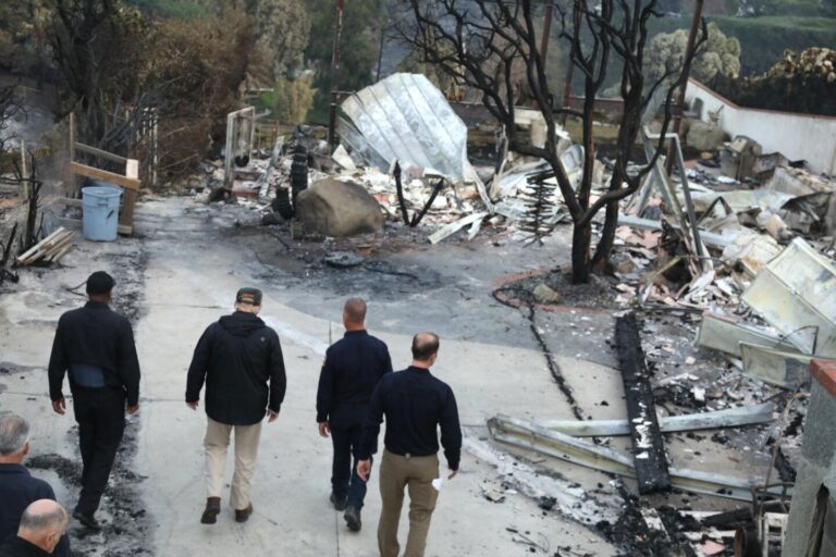Trump tours LA fire destruction amid worries about disaster aid.