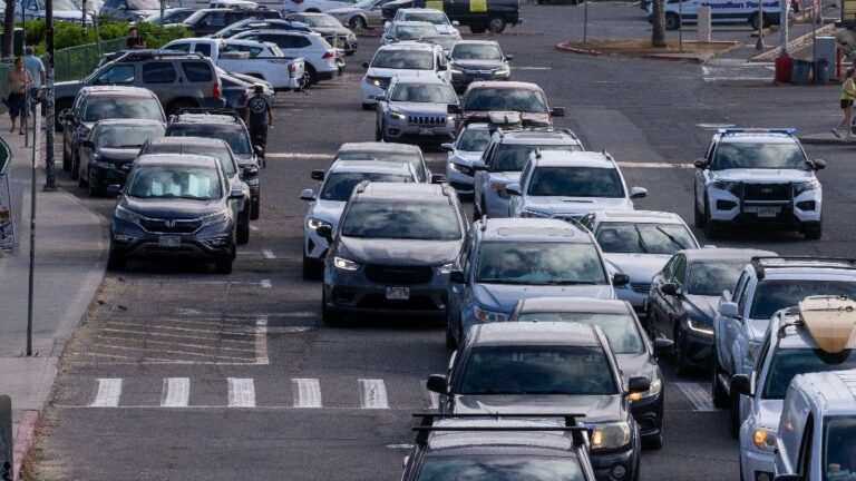 Hawaiians cram roads away from coasts as tsunami waves arrive